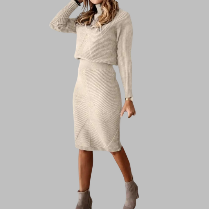 Damesjurk in beige gebreid patroon, lange mouwen, knielengte, ideaal voor herfst en winter. Stijlvolle warme kleding voor vrouwen.